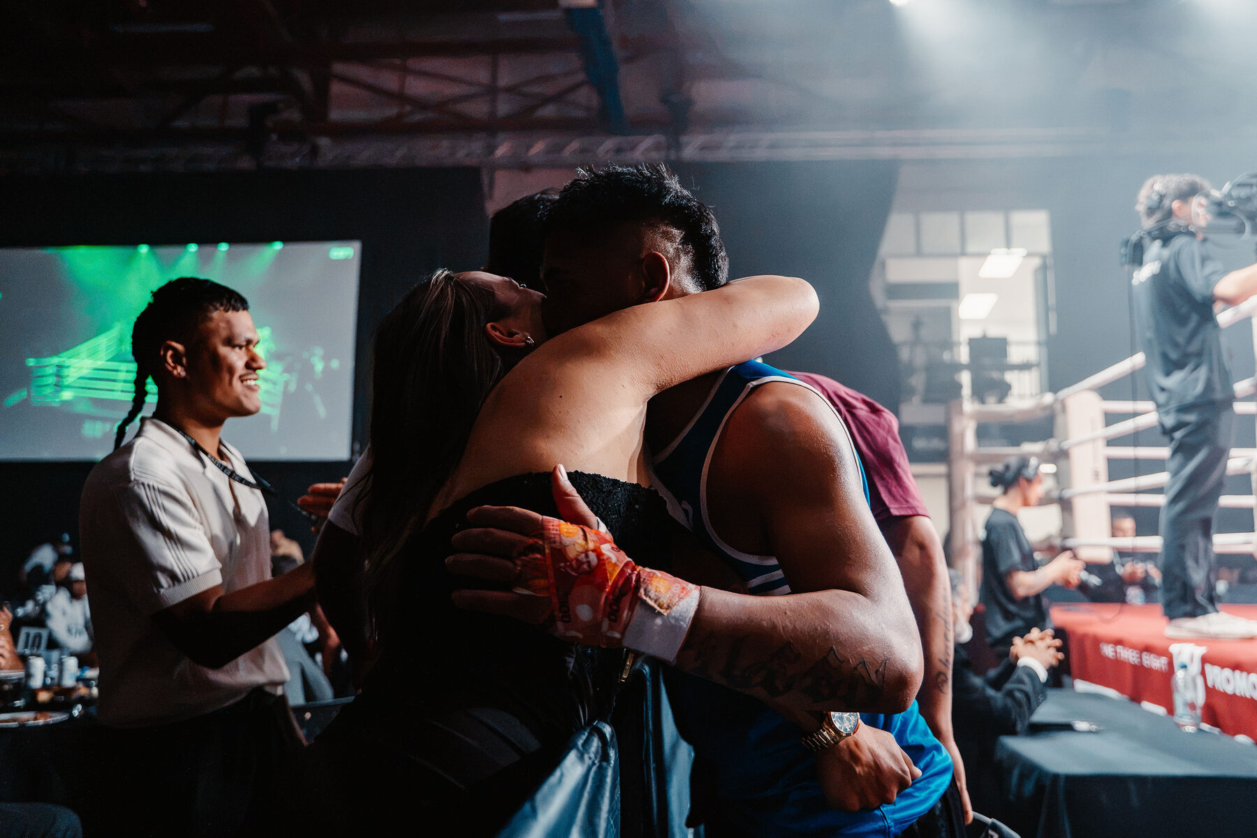 Ringside embrace after the final bell